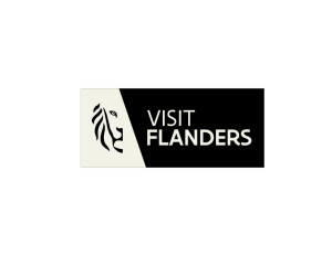 Visit Flanders logo. Light grey text on a black square background reads Visit Flanders. To the left of the text is an outline graphic of a lions face.