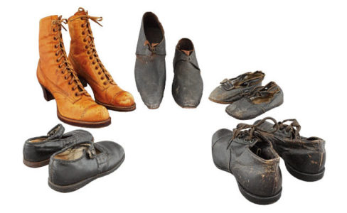 Five pairs of shoes and boots from the Guelph Museums collection arranged in a semi circle. White background.