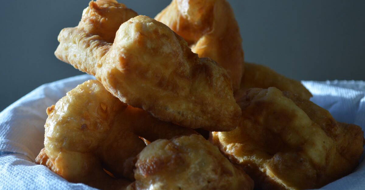 Close up photo of bannock piled on a plate.