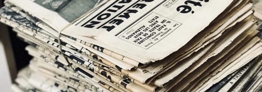 Stock photo of a stack of newspapers.