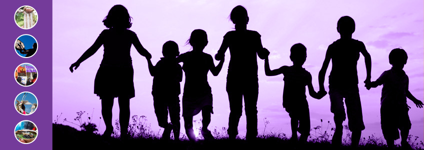 Silhouettes of seven children standing in a line while holding hands. The background is gradient purple.