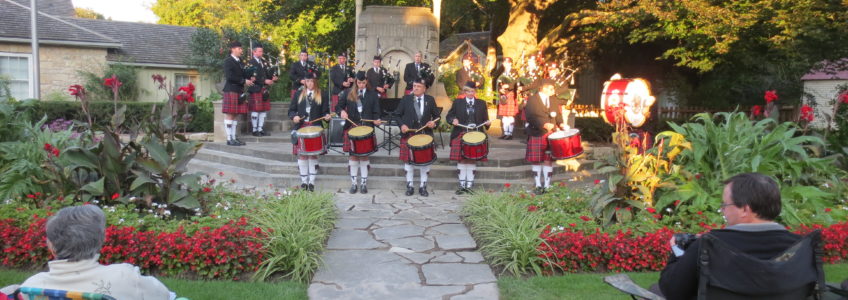 Photo of the Guelph Pipe Band performing at McCrae Memorial Gardens, 2004.