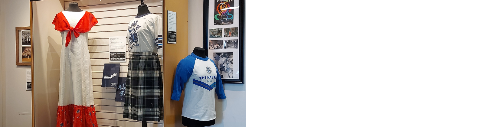 Exhibition installation view featuring a choir dress, a high school uniform plaid kilt and a t-shirt